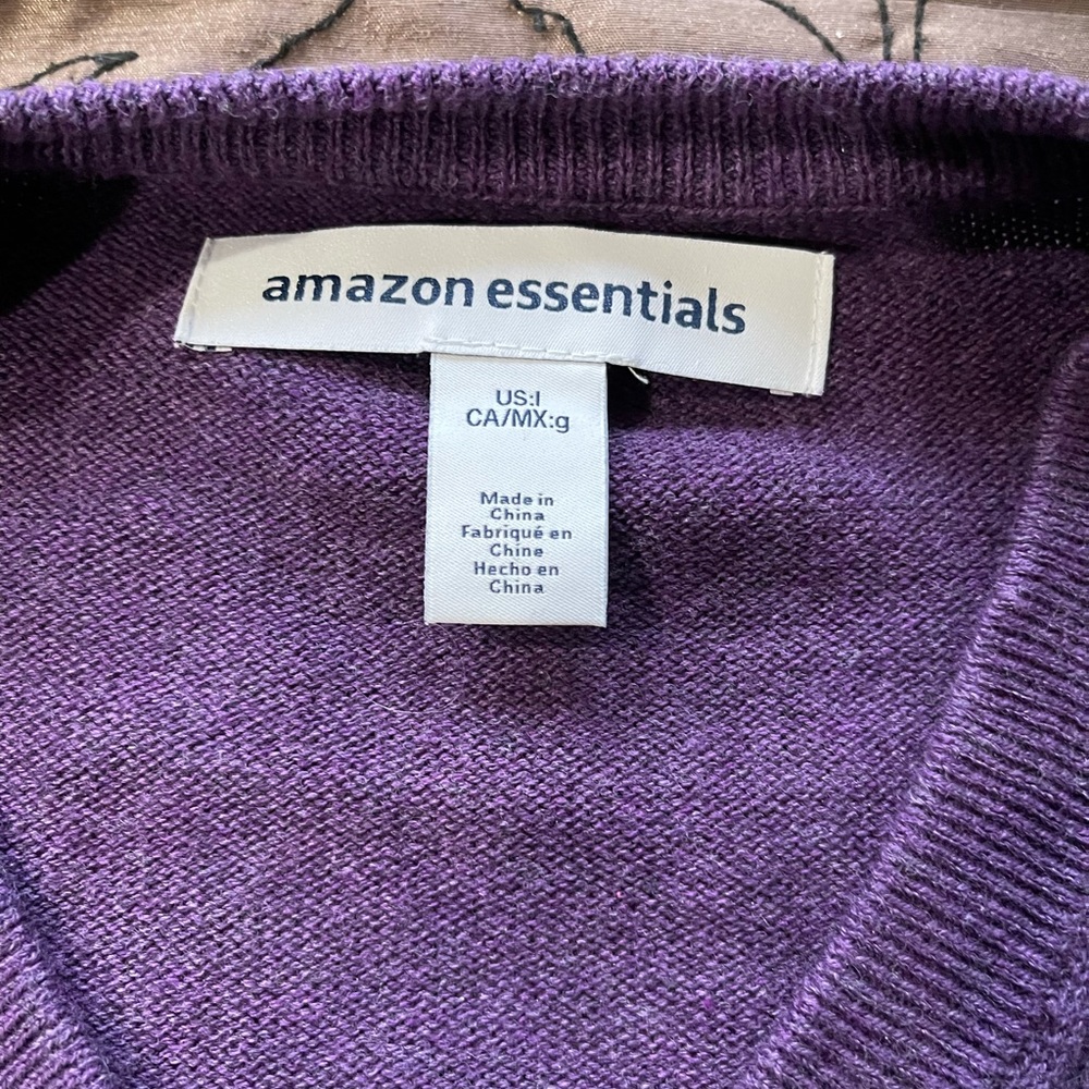 Long sleeve v-neck sweater in dark purple.